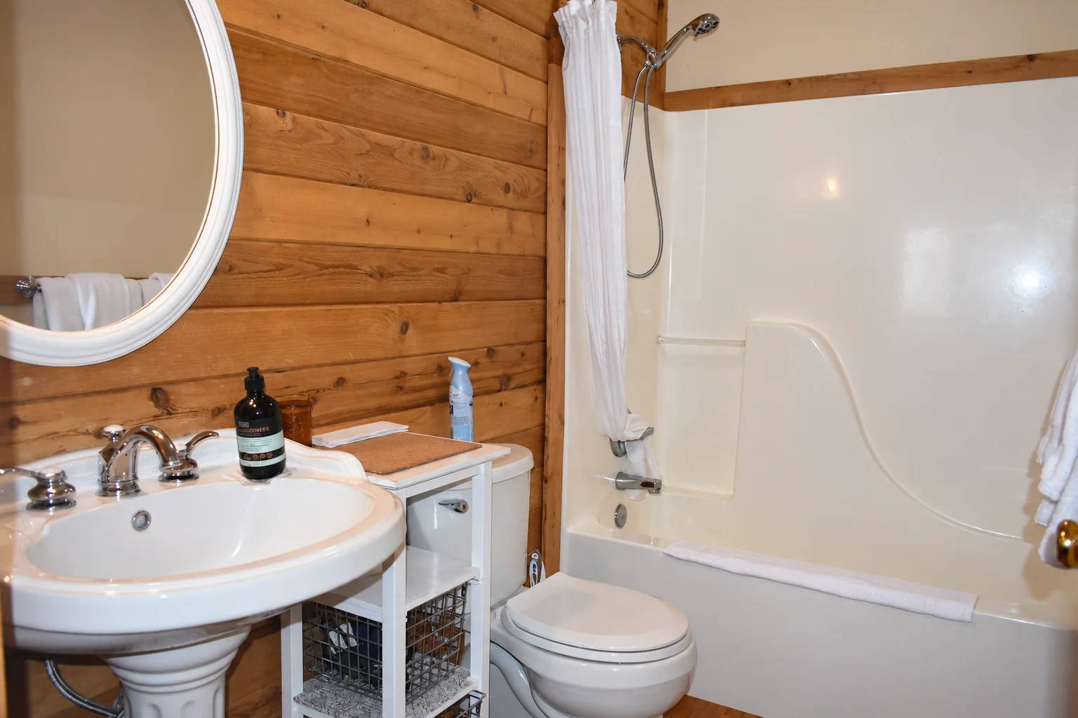 Private bathroom with bathtub and shower in Northern Exposure Cabin