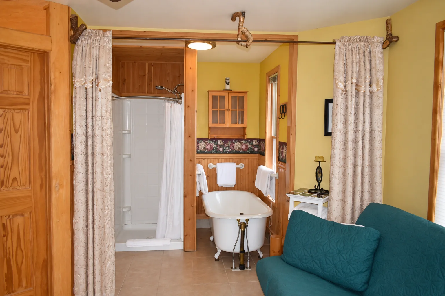 Bathtub and shower in the Denali View Suite bathroom