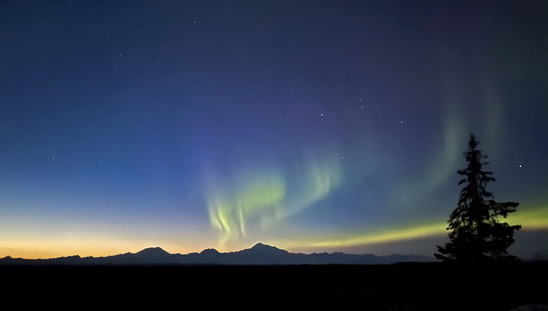 Northern lights above the Alaska Range viewed from Denali Overlook Inn