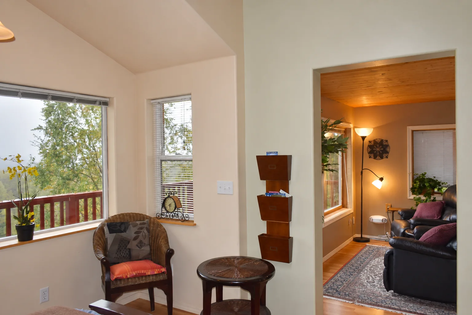 Window sitting area overlooking the surrounding forest in Northern Exposure Cabin