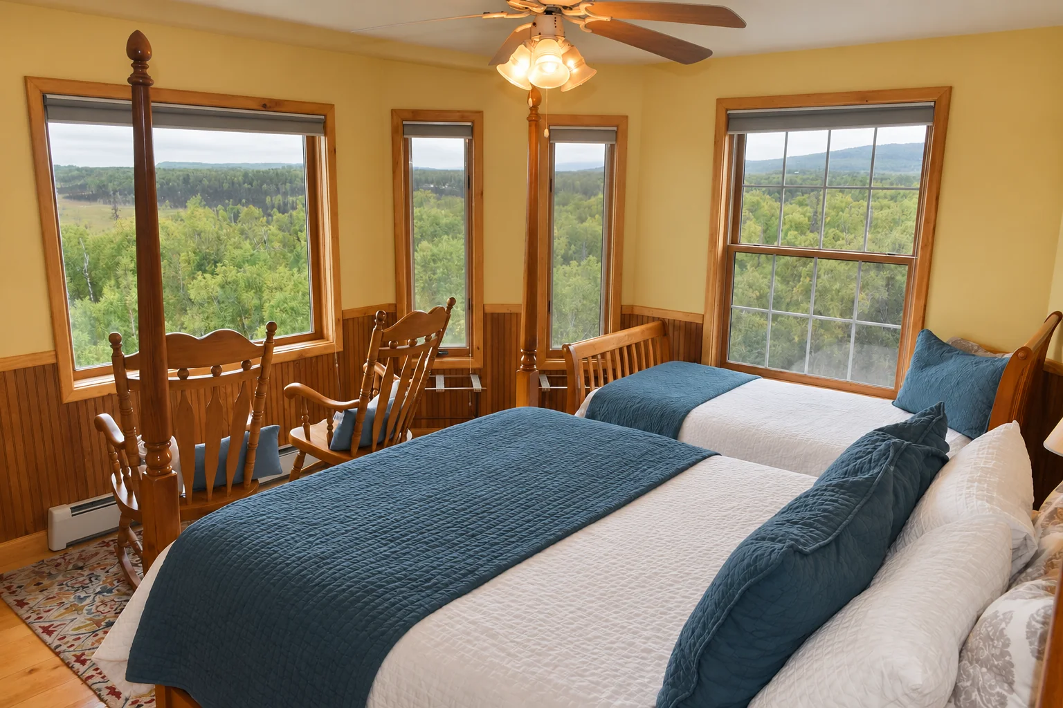 Queen and twin beds with surrounding views in Victorian Room at Denali Overlook Inn